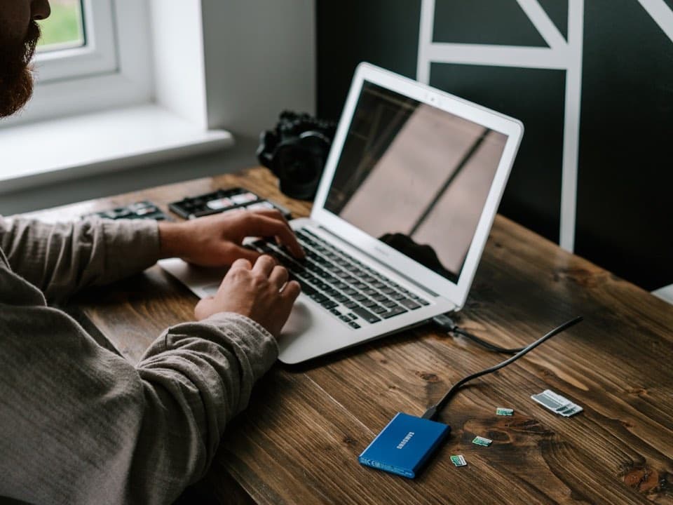 Portable solid-state drive connected to a laptop