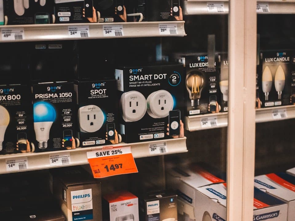 Smart plugs displayed in an electronics store